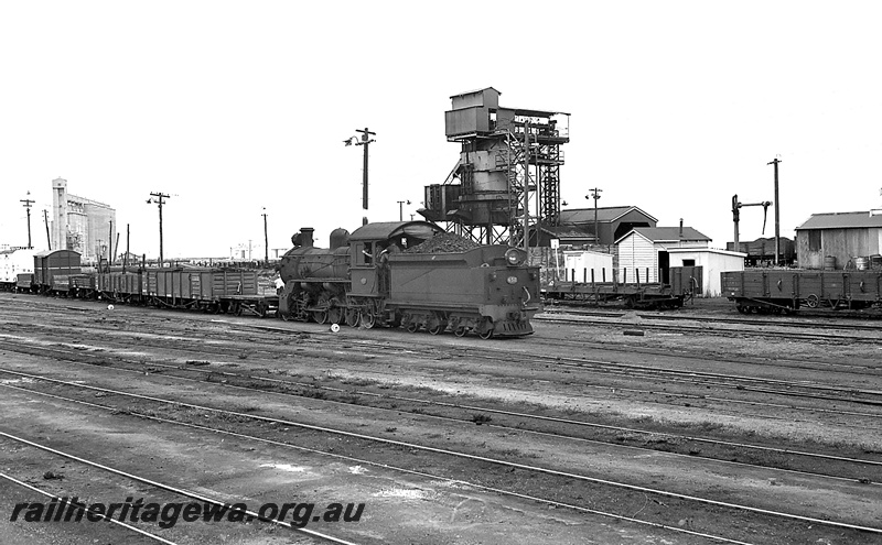 P24225
FS class 452, shunting a rake of wagons and van, grain silo, coaling stage, water crane, goods shed 2nd class, wagons, tracks, yard, Bunbury, SWR line, side and rear view
