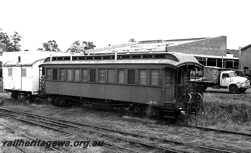 P24240
Former AL class 40, now workers' van, small white van, tracks, truck in background, Manjimup, PP line, side and end view 

