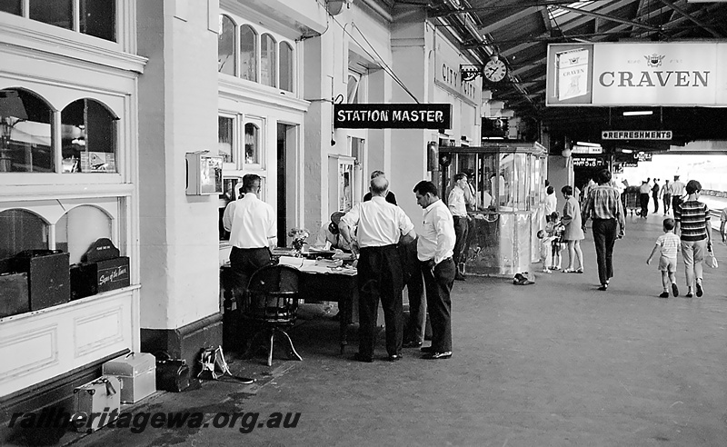 P24247
Roster Clerks Office jumble sale, passengers, officials, outside Station Master office, on platform under roof, Perth city station, view from platform
