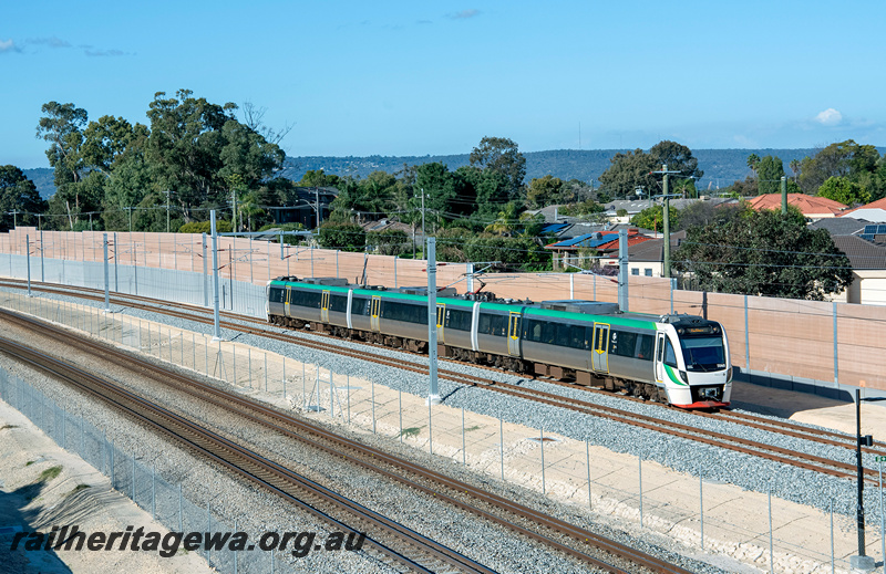 P24325
EMU set 60 comprising BEA, BEB, BET class railcars, hills in the background, Thornlie, SWR line, side and end view
