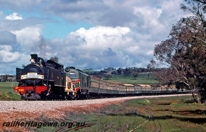 P24328
DD class 592, XA class 1405, double heading Australian Railway Historical Society tour train to Bolgart, rural setting, north of Coondle, CM line, front and side view
