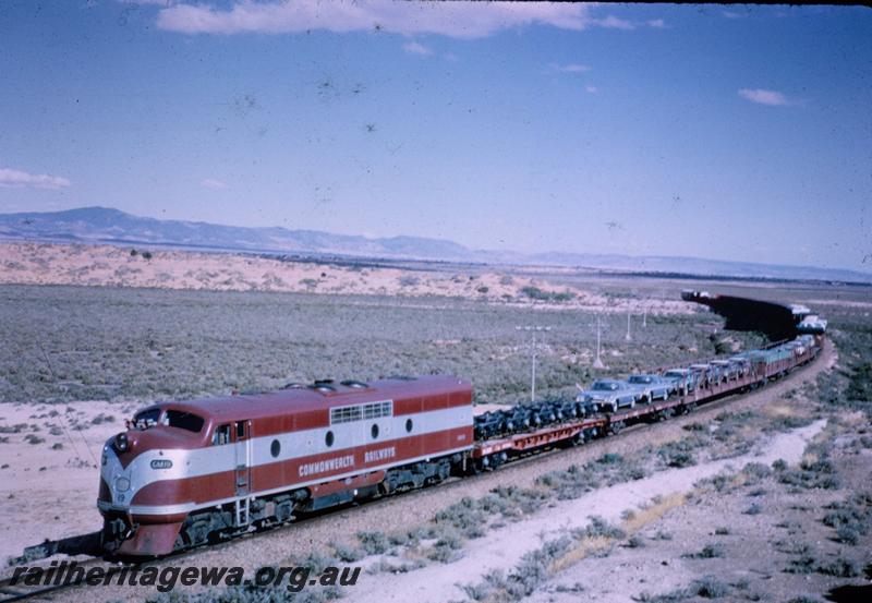 T00095
Commonwealth Railways (CR) GM class 19, hauling freight train on the Trans Australia Railway. TAR line
