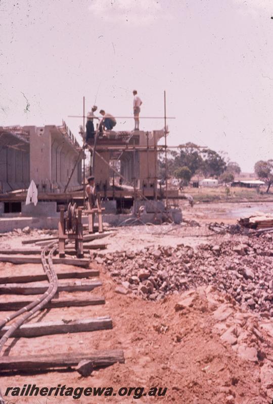 T00210
3 of 5 views of the construction of the dual gauge concrete bridge over the Avon River at Northam for the Standard Gauge Project. Pulling cables through concrete beams. 
