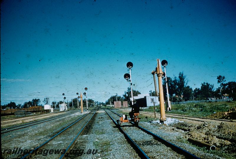 T00257
Motorized gangers trolley, water column, colour light signals, Pinjarra, SWR line.
