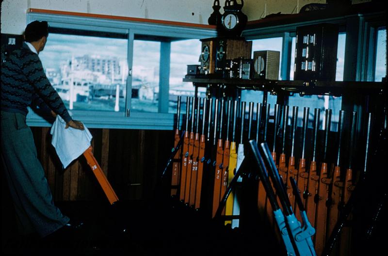 T00280
Signal box, Perth Station, west end, internal view, signalman operating
