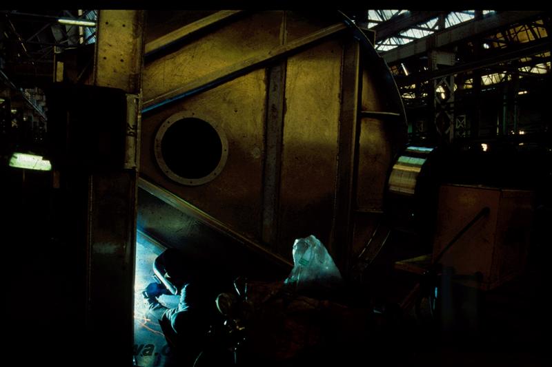 T00374
XU class wheat wagon under construction, Boiler Shop South, Midland Workshops, end view of the wagon on its side, at the welding stage
