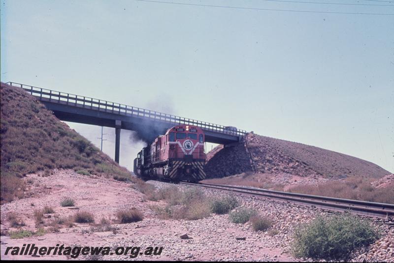 T00879
Mount Newman Mining locos, road overpass, on iron ore train
