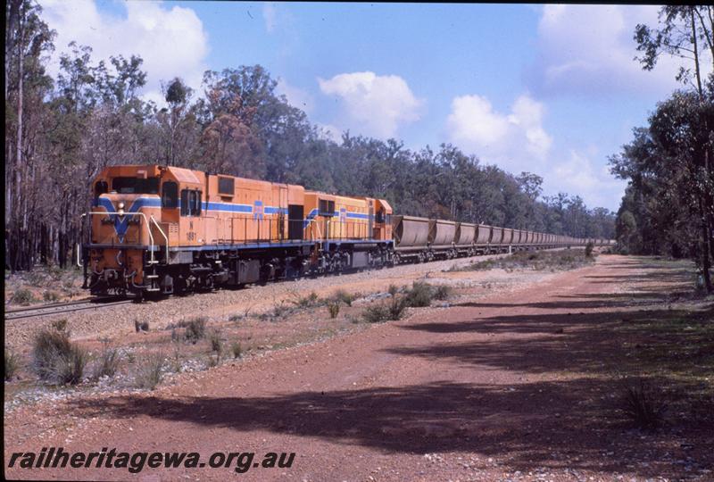 T01020
N class 1981 in the Westrail orange with blue stripe livery double heading on a bauxite train at Jarrahdale, view along the train
