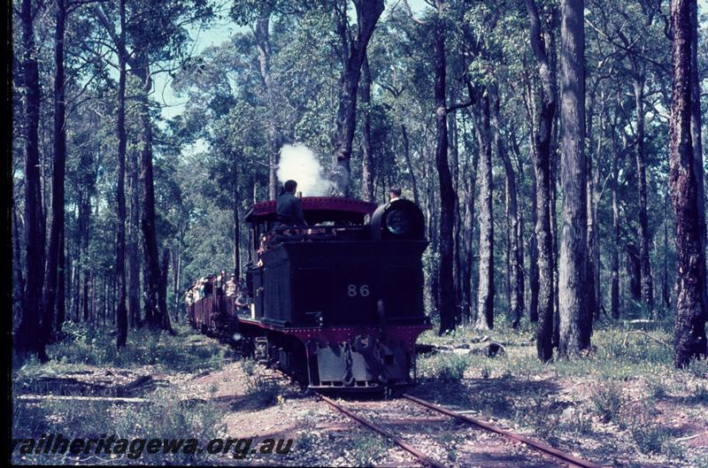 T01175
YX class 86, Yornup, rear view, hauling train of open wagons with passengers on tour 
