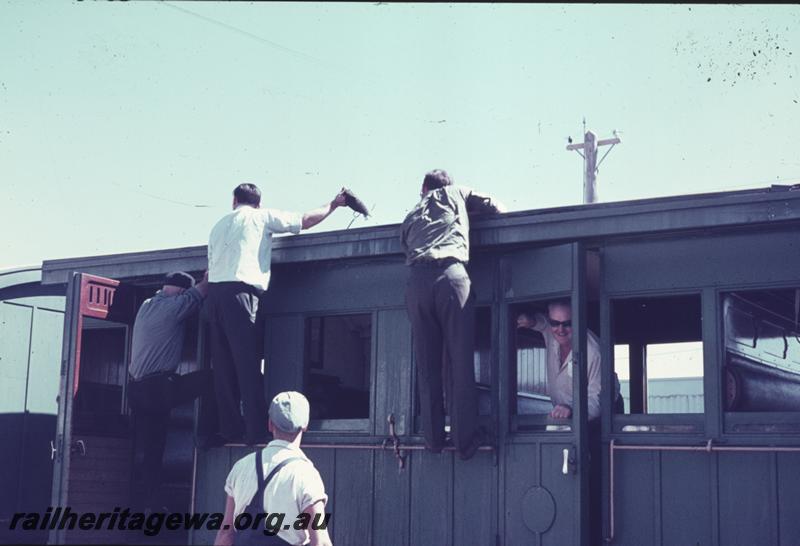 T01193
Passengers on tour train putting out fire on carriage roof
