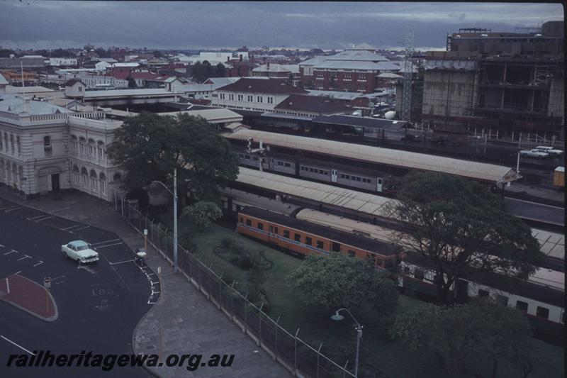 T01747
Perth Station, elevated view, railcars in orange and green red & white liveries in scene
