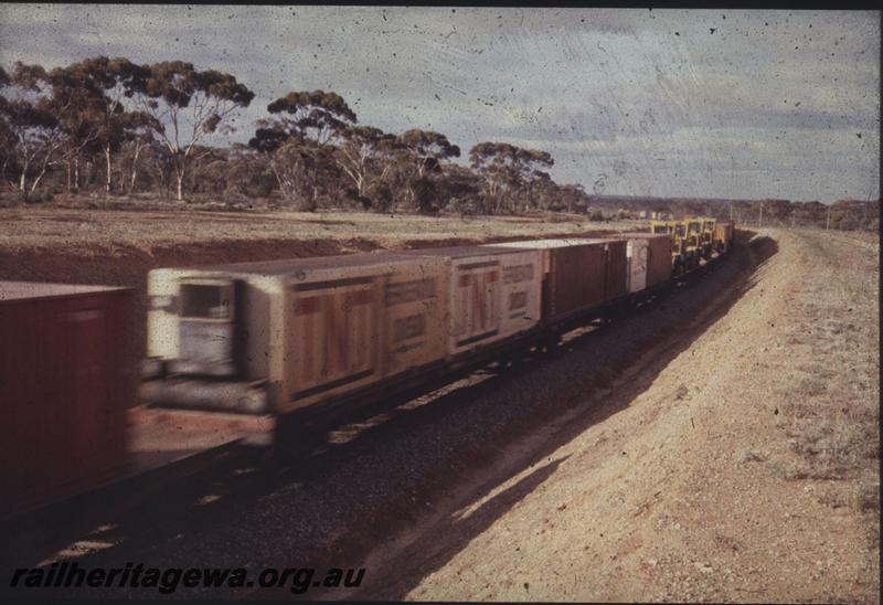 T01836
Freight train, Standard Gauge. Container wagon only in view 
