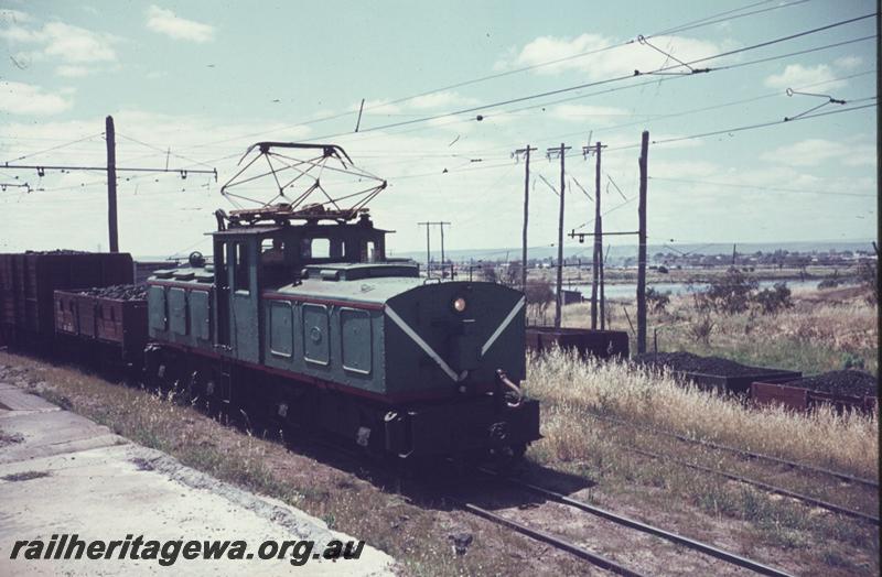 T01897
SEC electric loco No.1 propelling wagons loaded with coal towards the  East Perth Power Station, side and front view
