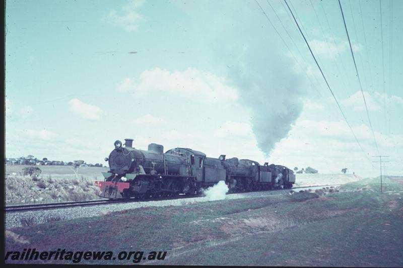 T02376
W class 944 with two PM/PMR class locos all tender leading and in steam, heading as a light engine movement from Avon Yard to the Northam loco depot. View from the rear of the train looking forward
