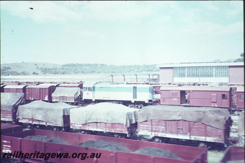 T02422
J class loco, on narrow gauge transfer bogies, narrow gauge wagons, marshalling yard, Avon Yard
