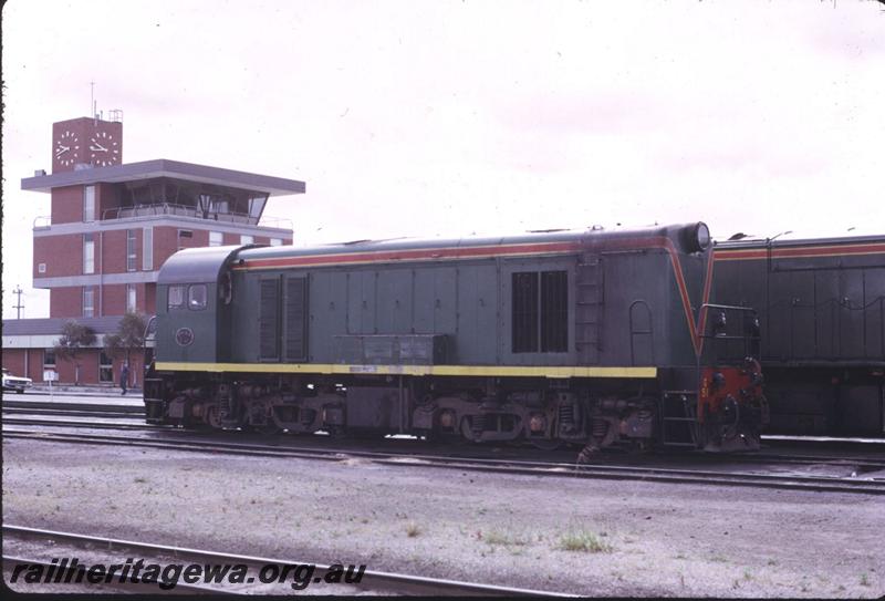 T02539
G class 51 in the green with red stripe livery, side and front view, Yardmaser's Office and Control Tower in the background, Forrestfield Yard
