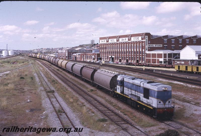 T02725
K class 205, Fremantle Yard, wool stores in background, grain train

