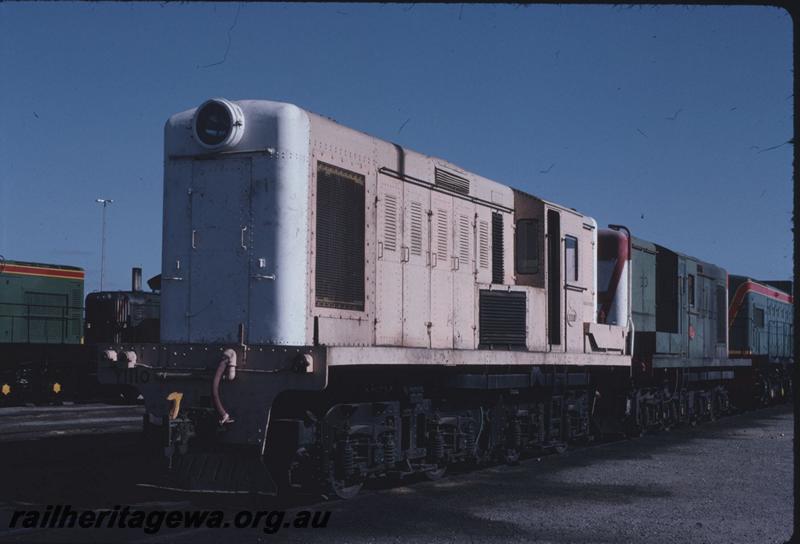 T02788
Y class 1110, pink livery with white front, long hood end and side view Forrestfield Yard
