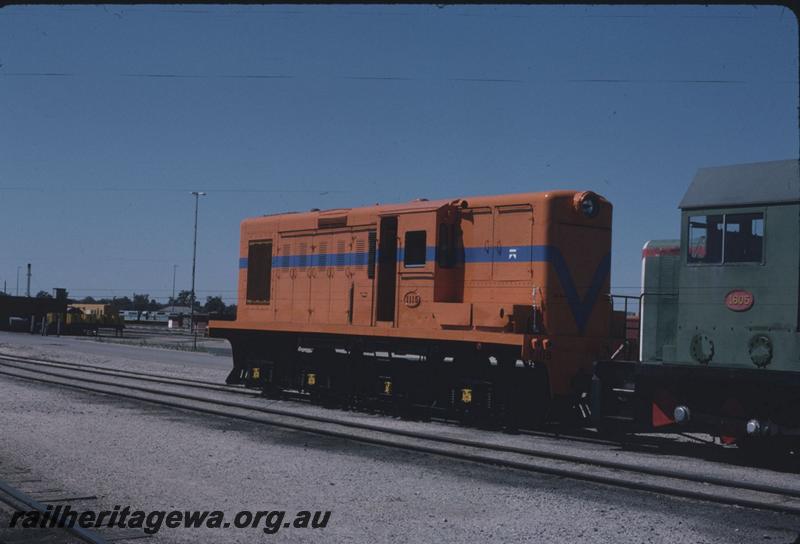 T02790
Y class 1115, orange livery with blue stripe but without the white lining, coupled to B class 1605, Forrestfield Yard, short hood end and side view.
