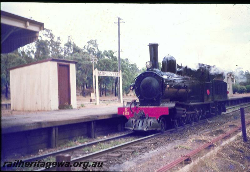 T02916
G class 123, station building, platform shed, nameboard, Parkerville, ER line, on light engine trial to Chidlow after a general overhaul
