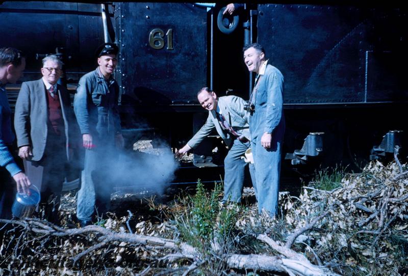 T02986
Millars loco No.61, group of men in front of cab
