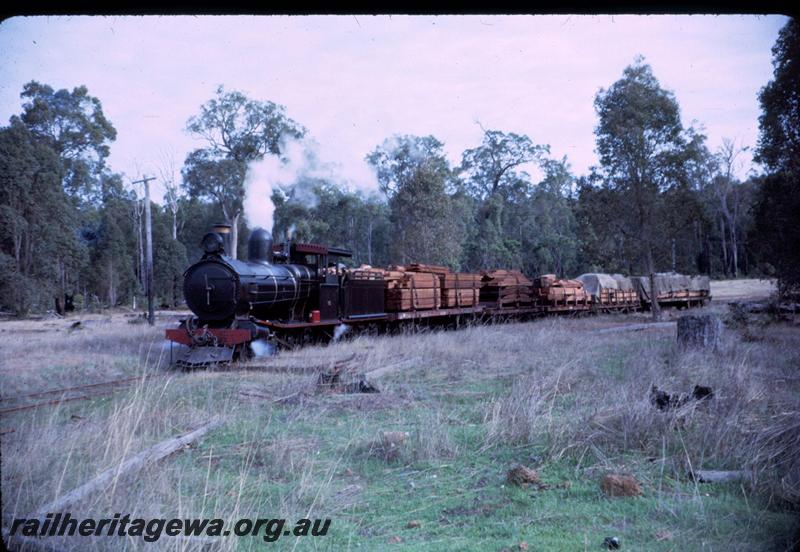 T03138
Bunnings YX class 86 loco, Yornup, hauling loaded timber train
