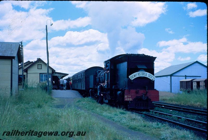 T03531
MSA class 499 Garratt loco, rear view, signal box, station building, goods shed, Pinjarra, SWR line, ARHS tour train to Dwellingup, D class 5165 four wheel van with an advertisement for 