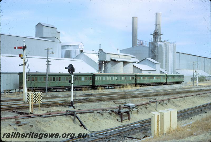 T03854
ACM class 36, AA class 201, ACM class 395, ACM class 33, semaphore signal, colour light signal cement works, Rivervale, carriages stored on cement works siding
