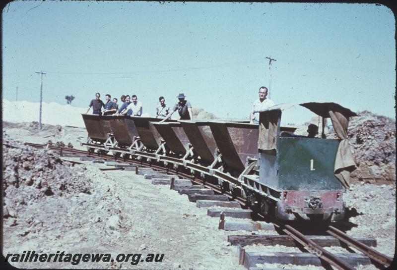 T03923
Maylands Brickworks loco No.1 hauling train of hoppers with ARHS members on board, end view of loco
