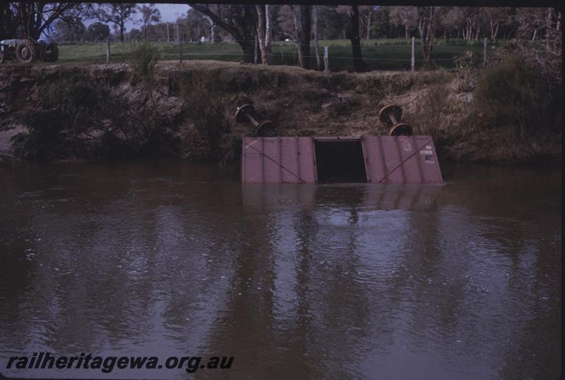 T03938
DC class wheat wagon upside down in water as a result of the flooding of the Collie River
