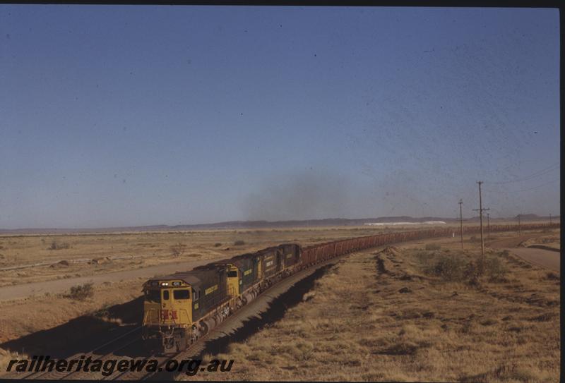 T04049
Hamersley Iron Alco loco CE636R class 4041, leads two rebuilt and one non-rebuilt units, empty train, departing Seven Mile Yard, RIO line
