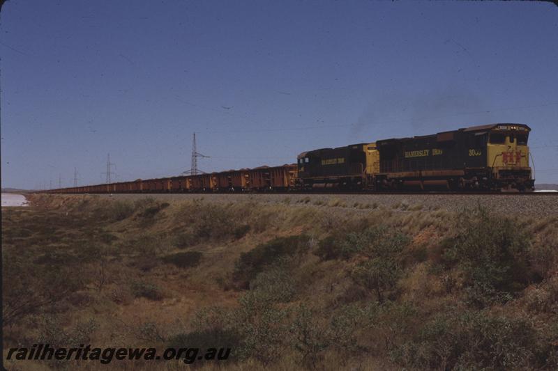 T04055
Hamersley Iron Alco rebuild CE636R class 3009 and M636 class 4046, loaded train bound for the unloader, Anchovy Flats, Dampier, RIO line
