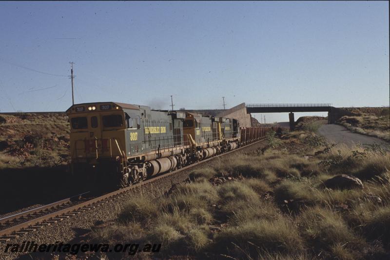 T04056
Hamersley Iron triple headed Alco CE636R class 3017, CE636R class 3007 and an unidentified unit, empty train, Robe River fly-over, Western Creek, RIO line
