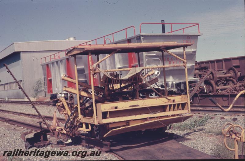 T04058
Hamersley Iron sleeper inserting track machine, Seven Mile workshops, lube oil wagons behind
