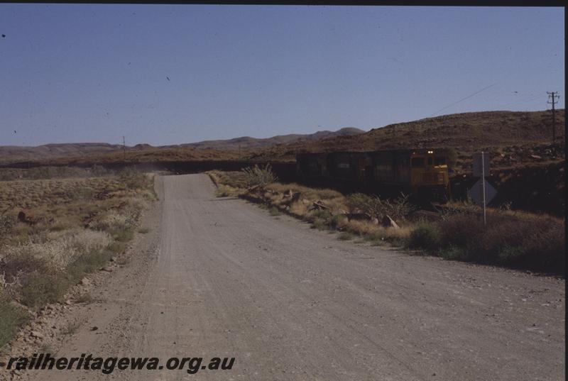 T04065
Hamersley Iron triple headed loaded train, CE636R class 4032, about to go under the Robe River fly-over at Western Creek, RIO line
