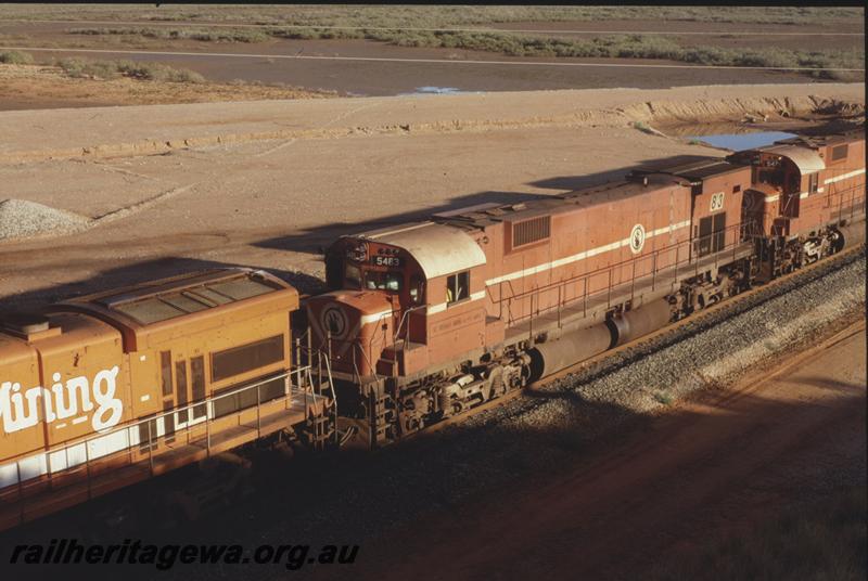 T04073
Mount Newman Mining Alco loco M636 class 5483, empty train departing Nelson Point at Redbank Bank Bridge, BHP line
