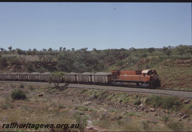 T04092
Mount Newman Mining Alco loco M636 class 5499, ballast train, Oroville ballast wagons, Shaw - Hesta area, BHP line
