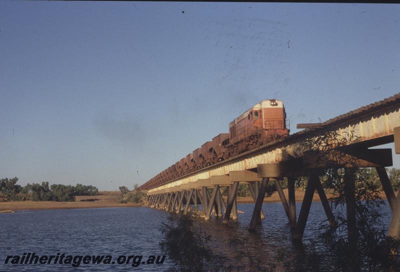 T04098
Goldsworthy Mining Limited English Electric loco A class 7, similar to WAGR K class, empty train, De Grey River bridge, BHP line
