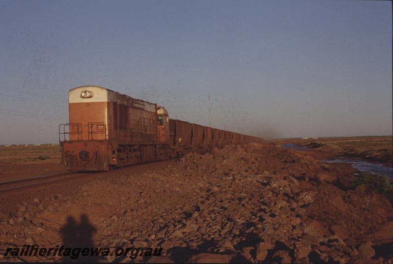 T04109
Goldsworthy Mining Limited English Electric loco A class 5, loaded train on causeway to Finucane Island, Boodarie, BHP line
