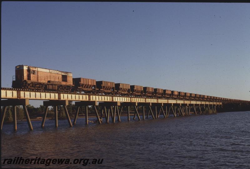 T04118
Goldsworthy Mining Limited English Electric loco A class 8, empty train, De Grey River Bridge, BHP line
