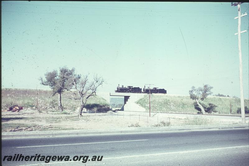 T04221
G class 118 towing G class 67 to Perth, Kenwick flyover, SWR line, distant side view.
