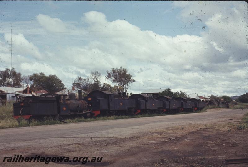 T04317
G class 117, DD class 593 and four other DD/DM class locos lined up, stowed at Northam, ER line, end and side view
