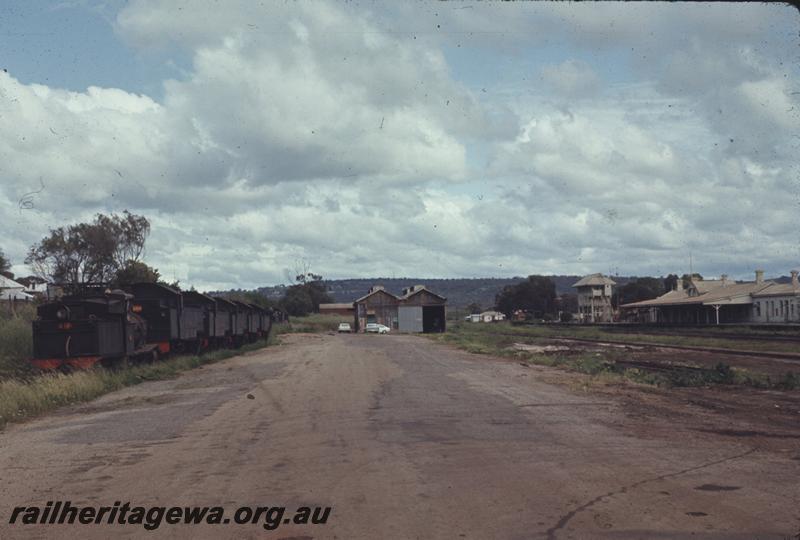 T04318
G class 117, DD class 593 and four other DD/DM class locos lined up, stowed at Northam, ER line, end and side view, shows also the goods shed, signal box and station building.
