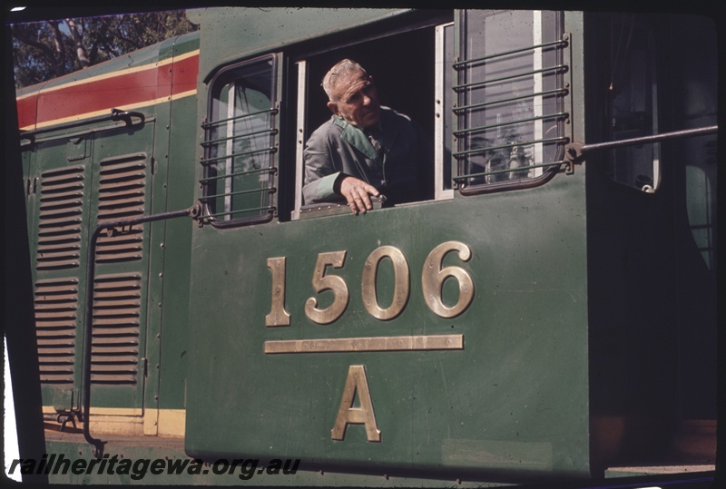 T04327
A class 1506,view of the cab side with the driver at the window, view shows the unpainted brass numbers and the cab side details. 
