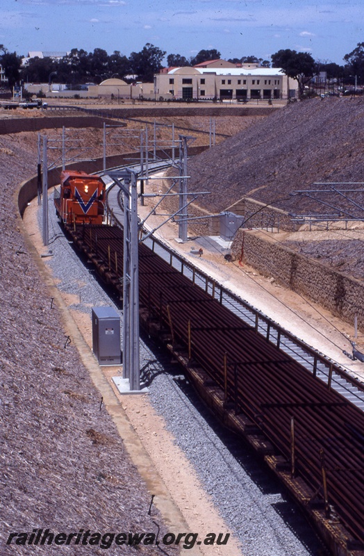 T04340
2 of 2, A class 1506 diesel locomotive in Westrail orange livery, track laying, Joondalup, NSR line..
