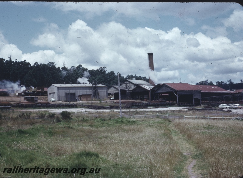 T04358
Pemberton Saw Mill, grass in foreground, buildings in middle distance, forest behind, PP line
