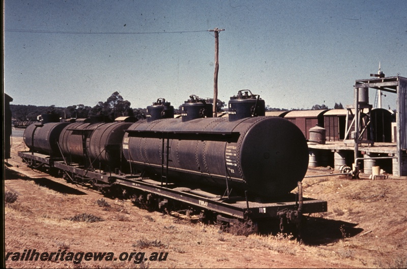 T04398
J class three dome bogie tank wagon coupled to a JD class bogie tank wagon, Norseman, CE line, side and end view, c1962
