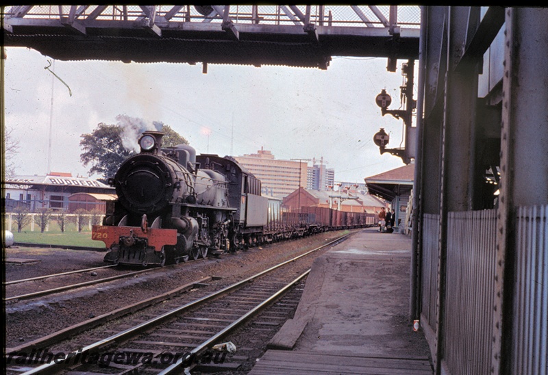 T04446
PMR class 720 steam locomotive hauling a goods train through the then East Perth station enroute to Bunbury. SWR line.
