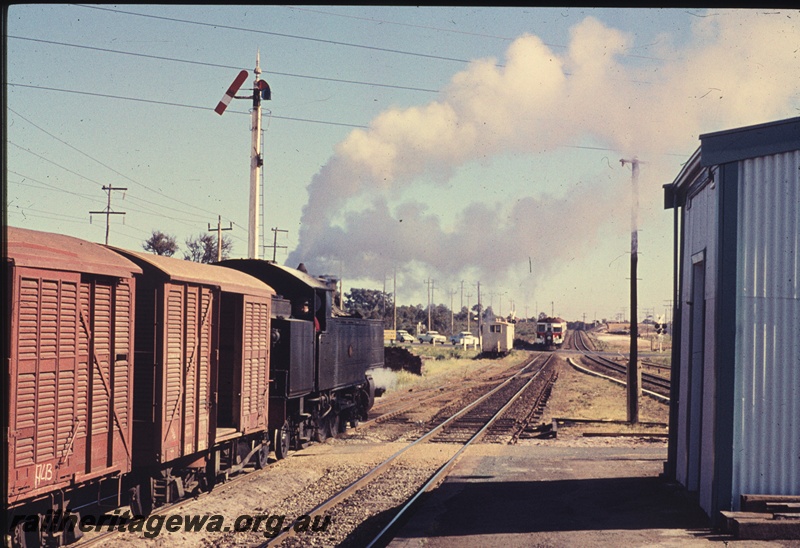 T04447
An unidentified DD class steam locomotive awaiting line clear of a suburban railcar at the west end of Welshpool station. SWR line.
