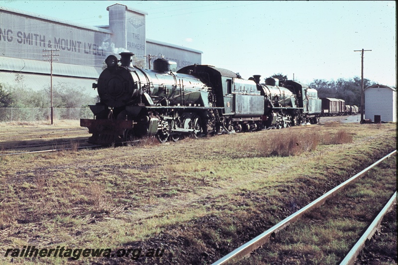 T04458
W class 924 and W class 906 steam locomotives pictured at Picton Junction off a RESO train. The Cumming Smith & Mount Lyell superphosphate works to left of locomotives. SWR line.
